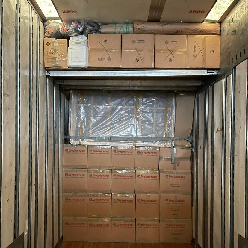 A U-Haul truck loaded tight by Weekend Warrior Moving